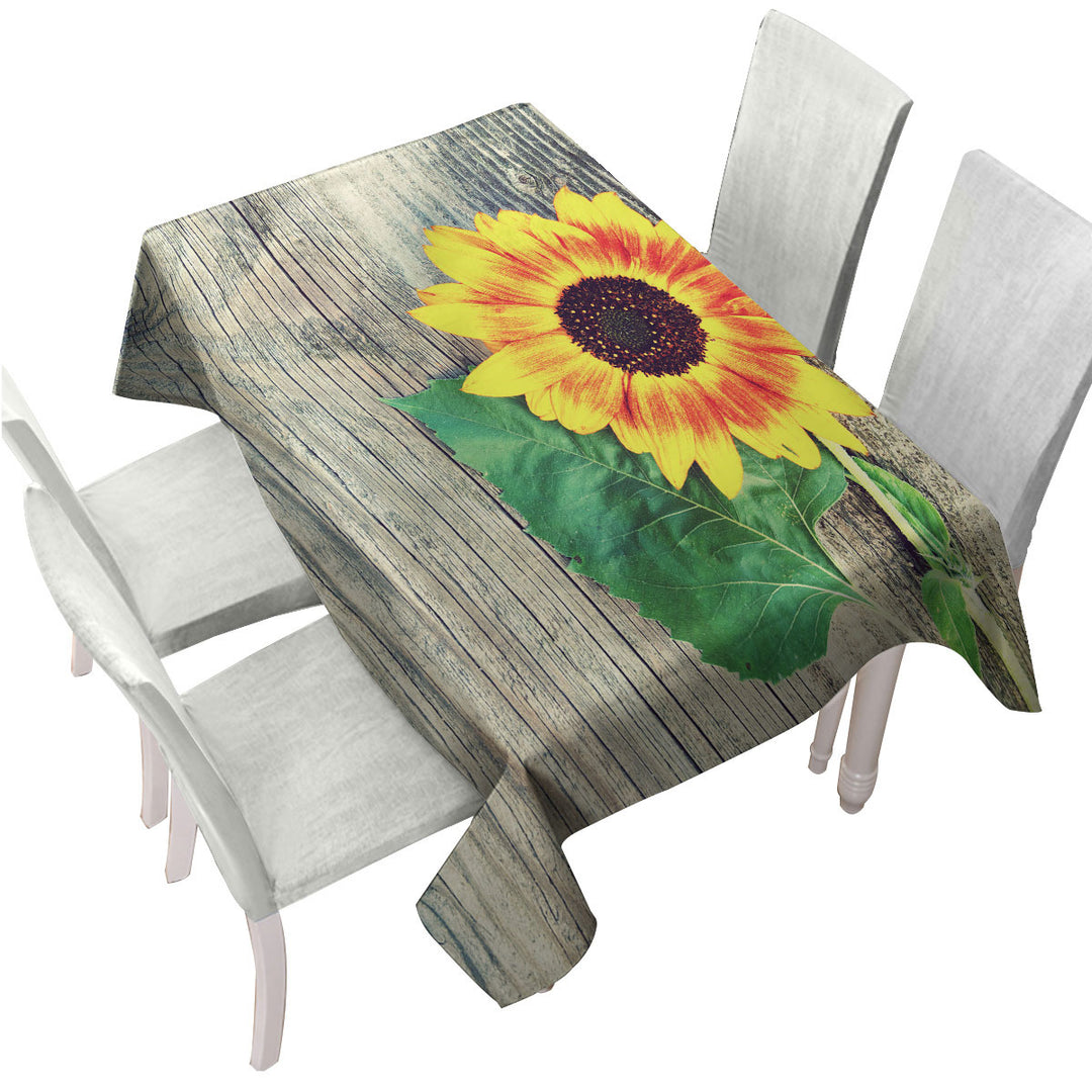 Custom tablecloths with Single Sunflower over Wooden Deck