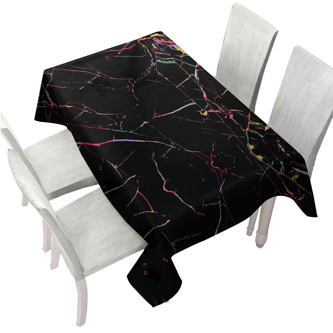 Multi Colored Cracks over Black Tablecloth