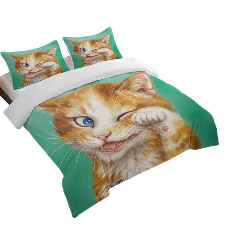 Paintings of Cute Ginger Cat over Green Coverlets
