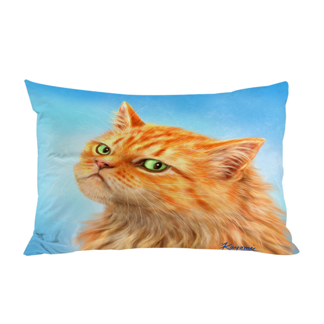 Suspicious Ginger Cat over Blue Pillow Cases