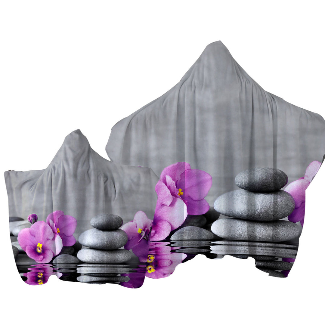 Towel with Hood with Purple Orchid Flower over Spa Pebbles
