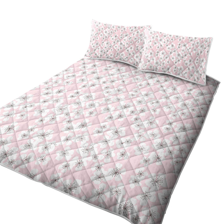 White Floral Drawings over Pink Coverlet