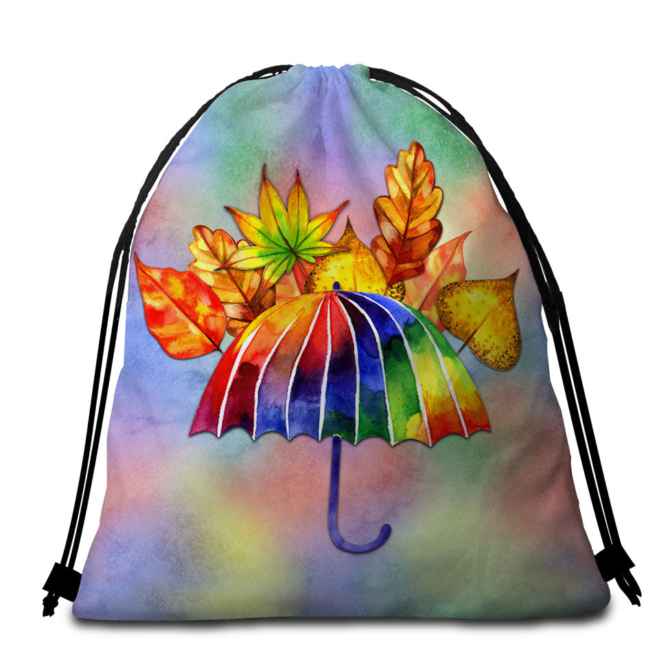 Beautiful Beach Bags and Towels Colorful Umbrella and Autumn Leaves