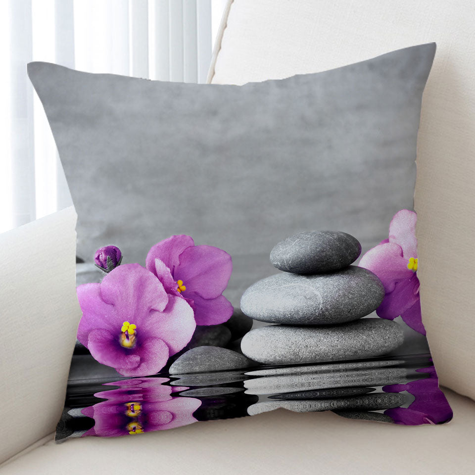 Decorative Cushions Purple Orchid Flower over Spa Pebbles