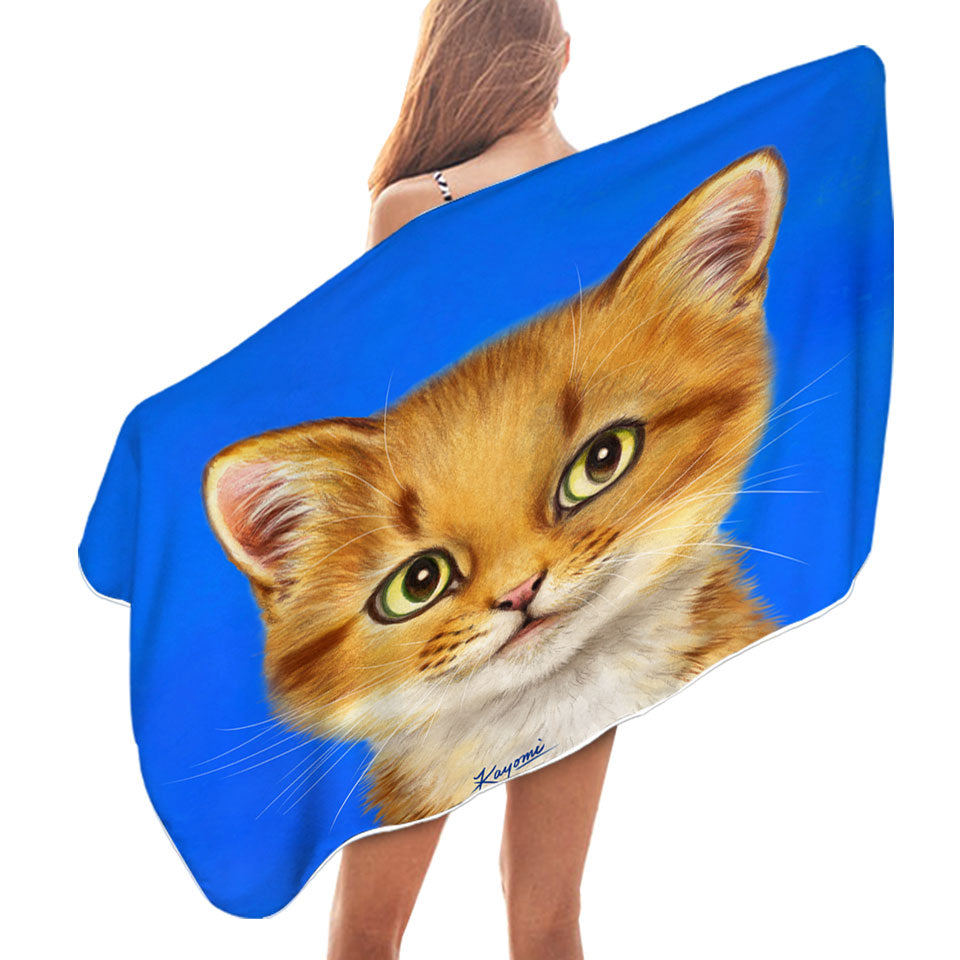 Handsome Ginger Cat over Blue Microfibre Beach Towels