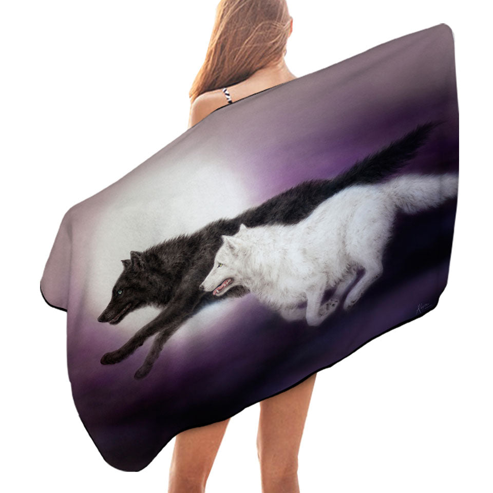 Moonlight Run Black and White Wolves Beach Towels