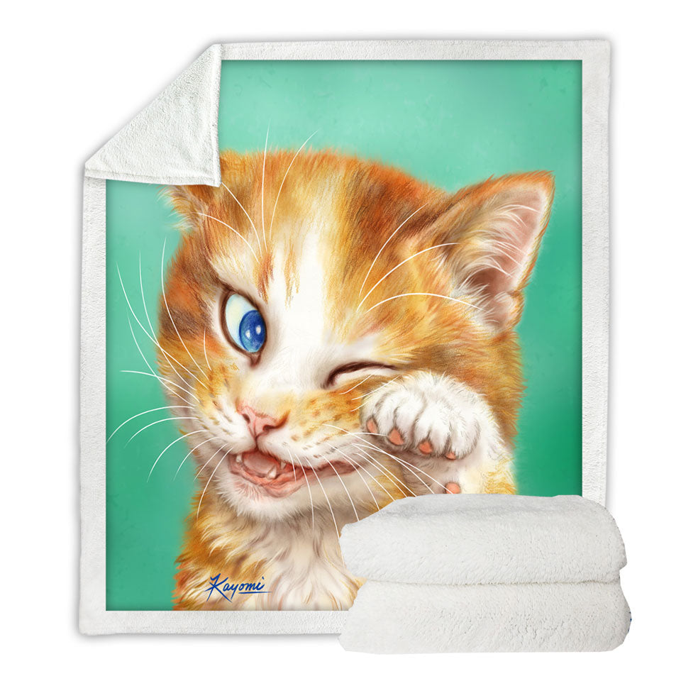 Paintings of Cute Ginger Cat over Green Sherpa Blanket