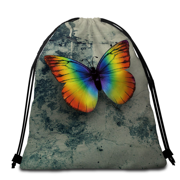 Rainbow Beach Towel Bags with Butterfly Over Concrete