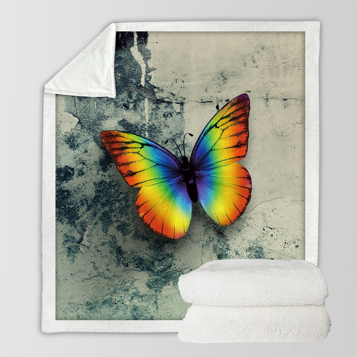 Rainbow Sherpa Blankets with Butterfly Over Concrete