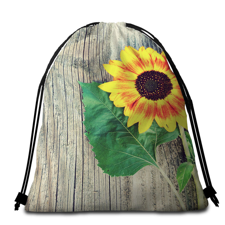 Single Sunflower over Wooden Deck Packable Beach Towel