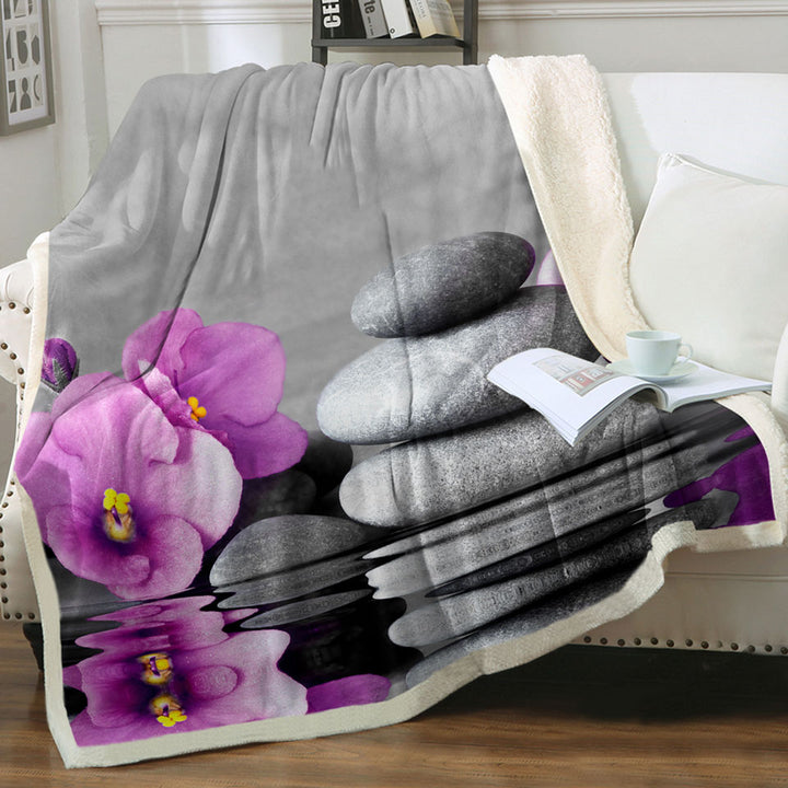 Spa Throws Purple Orchid Flower over Spa Pebbles